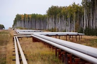 FILE PHOTO: Pipelines run at the McKay River Suncor oil sands in-situ operations near Fort McMurray, Alberta, September 17, 2014.   REUTERS/Todd Korol/File Photo