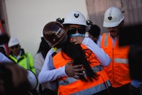 The sisters of miner Jose Angel Hernandez, who was found dead, embrace as they take part in a march with miners and relatives of missing workers demanding justice for workers who were abducted from a mine operated by Canada's Vizsla Silver Corp., after several bodies were found last month in a clandestine grave in Concordia, Sinaloa, in Zacatecas, Mexico, February 14, 2026. REUTERS/Edgar Chavez