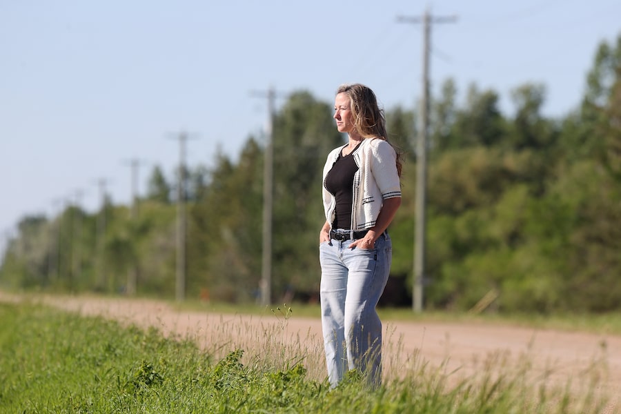 Christie Little looks out across a field once slated for a proposed hyperscale AI data centre near her home in Île des Chênes, Man.