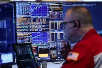 A trader works on the floor of the New York Stock Exchange (NYSE) at the opening bell on March 5, 2026 in New York City. Wall Street stocks retreated early Thursday as oil market volatility triggered by the Middle East war kept investors on guard. (Photo by ANGELA WEISS / AFP via Getty Images)
