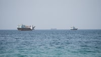 Vessels near the Strait of Hormuz, as seen from Musandam, Oman, Aug. 6.