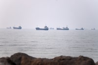 Commercial vessels are seen in the Strait of Hormuz off Bandar Abbas, Iran, Tuesday, June 30, 2026. (Amirhosein Khorgooi/ISNA via AP)