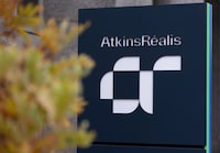 AtkinsRéalis Group Inc. reported its fourth-quarter profit fell compared with a year ago as it announced the sale of its remaining stake in the company that owns the Highway 407 ETR toll highway north of Toronto. Company signage is shown in Montreal, Friday, Nov. 10, 2023. THE CANADIAN PRESS/Christinne Muschi
