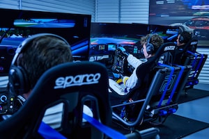On the lower level of the Paddock Motorsports Simulation venue are eight Eight Multimatic-built simulators that sit far enough part for coaches or other drivers to walk between and watch.