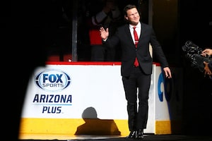 Shane Doan waves to fans at his jersey retirement ceremony in Glendale, Ariz., on Feb. 24, 2019. (AP Photo/Ross D. Franklin)