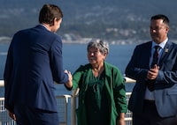 B.C. Premier David Eby shakes hands with Nisga'a Nation President, Eva Clayton during a Ksi Lisims LNG announcement of an environmental assessment certificate from the Government of British Columbia in Vancouver, on Tuesday, Sept. 16, 2025. THE CANADIAN PRESS/Ethan Cairns