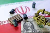 FILE PHOTO: Iranian flag, a U.S dollar banknote and minatures of oil pipes and barrels are seen in this illustration taken June 23, 2025. REUTERS/Dado Ruvic/Illustration/File Photo