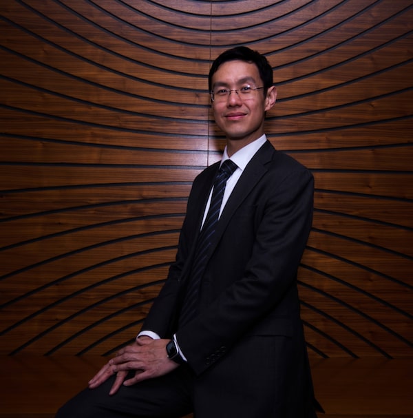Jeff Mo poses for a portrait on April 18th, 2024, in the board room at Mawer's Investment firm in downtown Calgary. 
(Louis Oliver/The Globe and Mail)