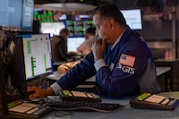 NEW YORK, NEW YORK - JULY 21: Traders work on the floor of the New York Stock Exchange (NYSE) on July 21, 2026 in New York City. Stocks were up over 200 points in morning trading despite ongoing tensions between the United States and Iran.  (Photo by Spencer Platt/Getty Images)