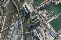 This image provided by Vantor shows smoke in an overview of port infrastructure in Novorossiysk, Russia, Wednesday, Aug. 12, 2026. (Satellite image ©2026 Vantor via AP)