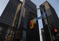 A red light on Bay Street in Canada's financial district is shown in Toronto on Wednesday, March 18, 2020.  