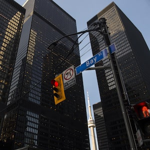 A red light on Bay Street in Canada's financial district is shown in Toronto on Wednesday, March 18, 2020.