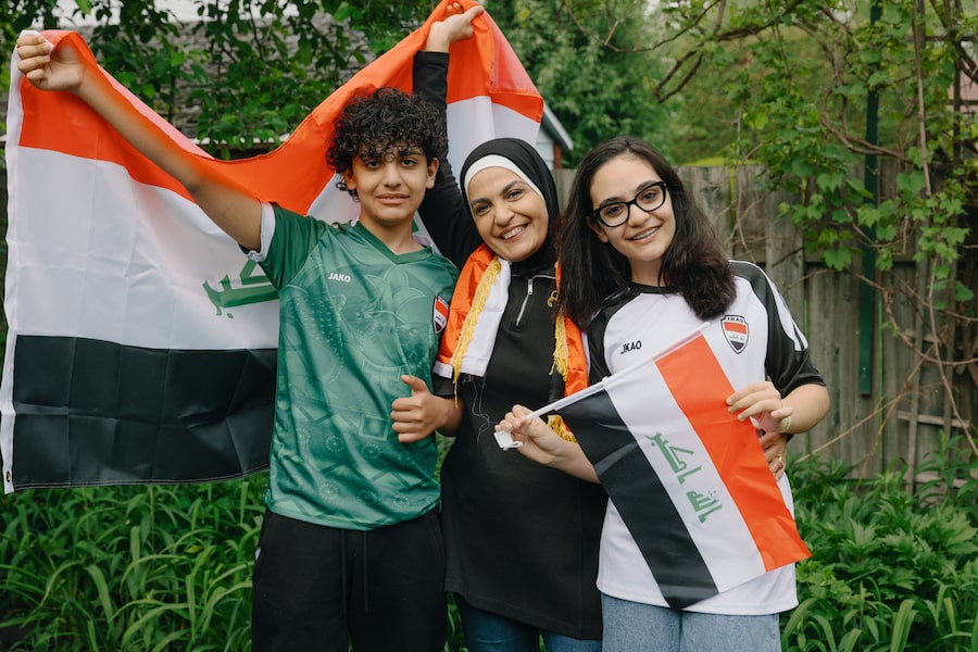Reem Mohammed, with children Taim and Dalia, was 11 when Iraq last went to the World Cup 40 years ago. The family is taking a road trip to Toronto from Laval, Que., to see Iraq play Senegal.