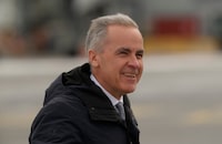 Prime Minister Mark Carney boards a government plane in Ottawa on Thursday, March 12, 2026. THE CANADIAN PRESS/Adrian Wyld