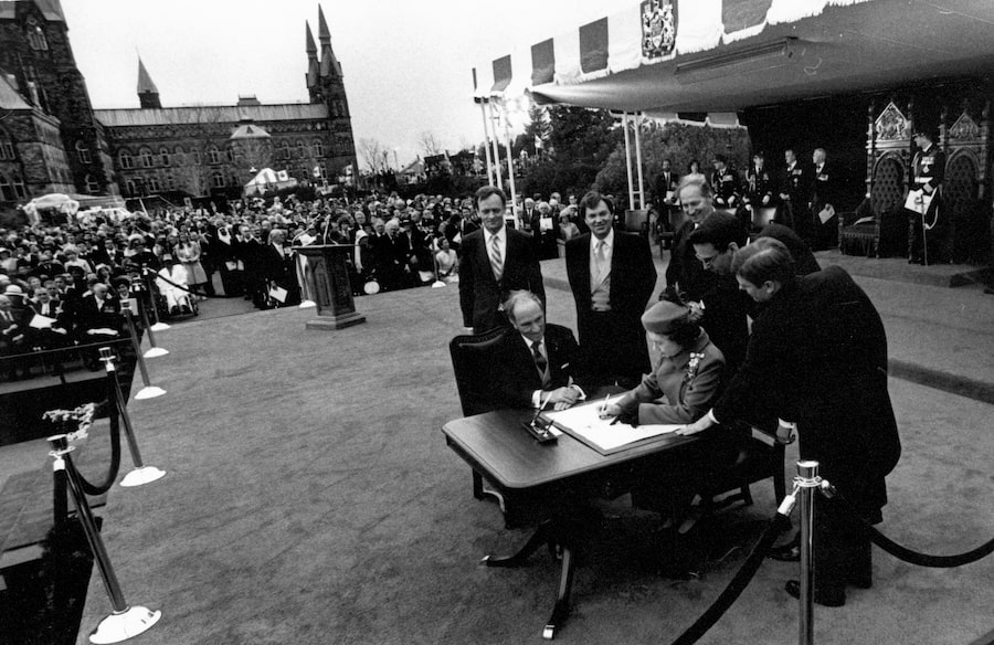 When Queen Elizabeth II signed a proclamation in Ottawa on April 17, 1982, it was official: The Canadian Constitution had come home, including a new Charter of Rights and Freedoms. This month, a key clause of that document is up for discussion at the Supreme Court.