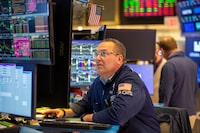 Traders work on the floor at the New York Stock Exchange in New York, Thursday, March 12, 2026. (AP Photo/Ted Shaffrey)