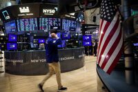 FILE PHOTO: Traders work on the floor at the New York Stock Exchange (NYSE) in New York City, U.S., July 3, 2024.  REUTERS/Brendan McDermid/File Photo