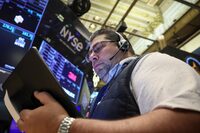 Traders work on the floor at the New York Stock Exchange (NYSE) in New York City, U.S., June 14.