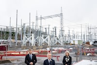 Prime Minister Mark Carney, Minister of Housing and Infrastructure Gregor Robertson, left, and CEO of the Major Projects Office Dawn Farrell, right, during an announcement at Skeena Substation in Terrace, B.C., on Nov. 13, 2025. 