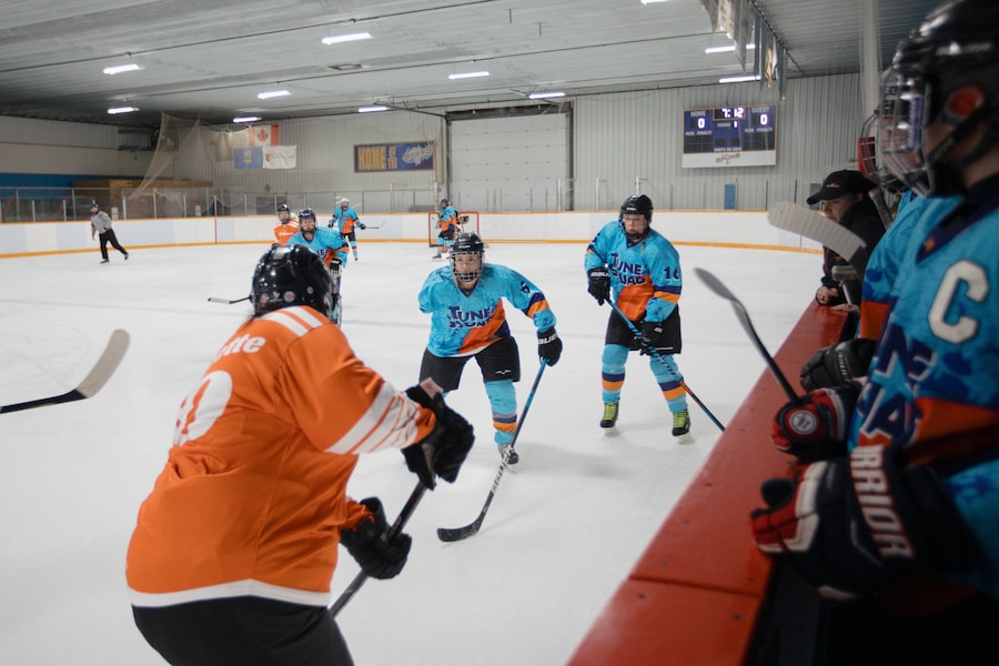 Sherry Sharko, middle, hunts for the puck at a March tournament in Bon Accord, Alta. When she was 19, she lost an arm in a farming accident in Australia. It has not dampened her determination for the game, though she does not play at the same professional level she did in her teens.