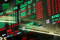 A board shows stock prices at the New York Stock Exchange in New York on April 22, 2026. 