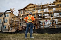 Housing construction continues in a new residential development in Richmond Hill, Ont. The federal and Ontario governments plan to spend $8.8-billion to reduce development charges in a bid to revive the market. 