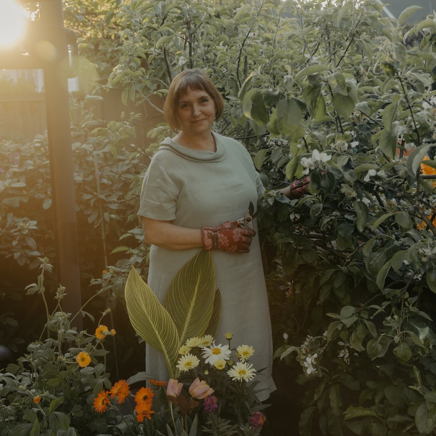 Leanne Johnson, president and chief executive of Gardenworks, tends to flowers in her backyard in North Vancouver. 