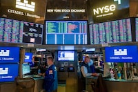 Traders work on the floor of the New York Stock Exchange (NYSE) on July 21, 2026 in New York City.  