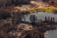 Wildfire damage is visible from the air in Collins First Nation, a small, remote Ojibwa community located in northwestern Ontario, on Wednesday.
