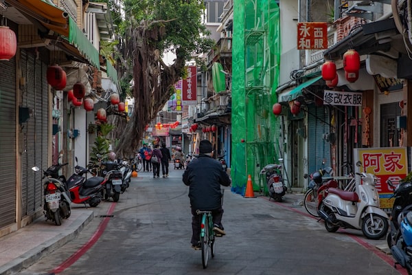 A man cycles through downtown Jincheng, the largest town on the island of Kinmen.