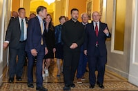 U.S. Senators accompany Ukraine President Volodymyr Zelensky, centre, to a meeting at the U.S. Capitol in Washington, D.C., on July 28.