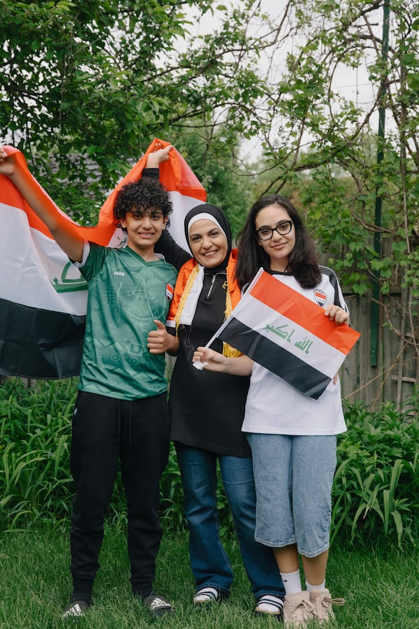 Reem Mohammed, with children Taim and Dalia, was 11 when Iraq last went to the World Cup 40 years ago. The family is taking a road trip to Toronto from Laval, Que., to see Iraq play Senegal.