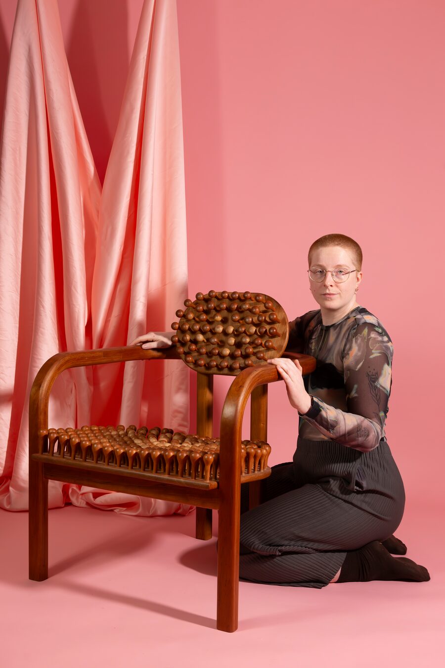 Alison Postma with their Knob Chair.
