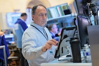 NEW YORK, NEW YORK - JULY 01: Traders work on the floor of the New York Stock Exchange during morning trading on July 01, 2026 in New York City. Stocks opened up with losses on the first day of trading in the month of July after the market had its best quarter since 2020.  (Photo by Michael M. Santiago/Getty Images)