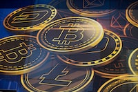FILE - An advertisement for the cryptocurrency Bitcoin is displayed on a building in Hong Kong on Nov. 18, 2021. (AP Photo/Kin Cheung, File)
