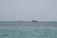 Vessels near the Strait of Hormuz, as seen from Musandam, Oman, August 10, 2026. REUTERS/Stringer