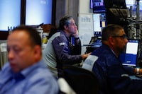 Traders work on the floor of the New York Stock Exchange (NYSE) in New York City, U.S., August 3, 2026. REUTERS/Jeenah Moon