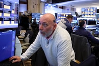 Traders work on the floor at the New York Stock Exchange (NYSE) in New York City, U.S., April 20.