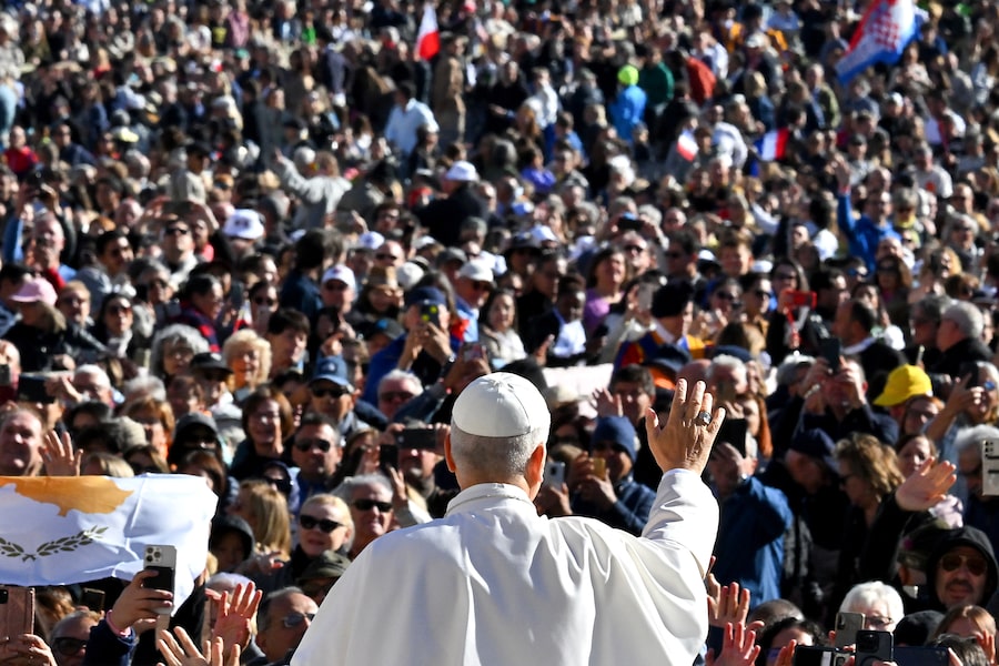 Pope Leo XIV waves to the crowd as he arrives to attend the Jubilee Mass for the Missionary World and Migrants at St Peter's Square in The Vatican on Oct. 4, 2025.