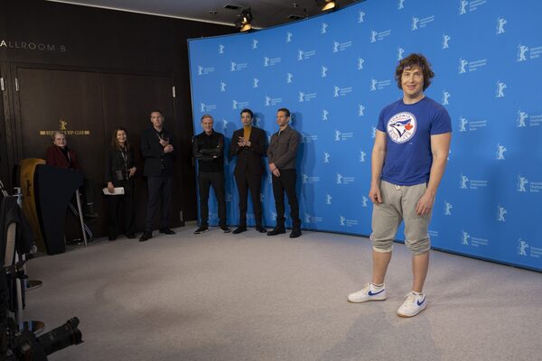 From centre left to right, actors Cary Elwes, Jay Baruchel and Glenn Howerton, look on as director Matt Johnson, right, is photographed by international media, at the Grand Hyatt Hotel in Berlin, Friday, Feb. 17, 2023, ahead of the world premiere of the Canadian film, Blackberry, in competition at the Berlin Film Festival, Germany. Joel Ryan Photo/The Globe and Mail