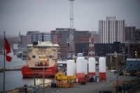 An offshore support vessel tied up and the marine base in St. John's. The province is launching calls for bids on 16 offshore oil and gas parcels.