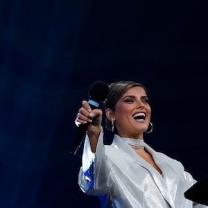 Nelly Furtado, Canadian singer and songwriter, speaks on stage during the Juno Awards nominees announcement in Toronto on Tuesday, February 6, 2024. THE CANADIAN PRESS/Nathan Denette