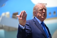 U.S. President Donald Trump prepares to board Air Force One on Saturday in Palm Beach, Fla., where he hosted a cryptocurrency conference at his Mar-a-Lago estate.