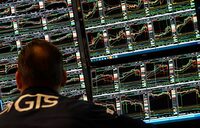 A trader works at his desk on the floor of the New York Stock Exchange (NYSE) during the first session of the new year on January 2, 2025, in New York City. (Photo by TIMOTHY A. CLARY / AFP) (Photo by TIMOTHY A. CLARY/AFP via Getty Images)