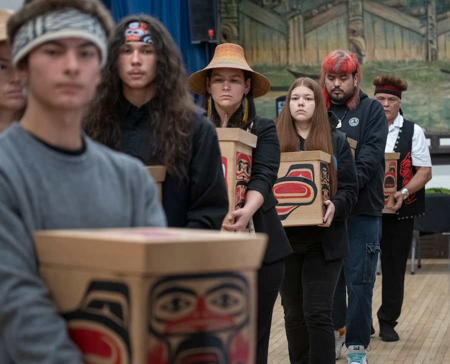 Burial boxes begin the journey from the Skidegate Community Hall to the cemetery in Skidegate, Haida Gwaii, B.C. during a Repatriation ceremony on Jan 18.