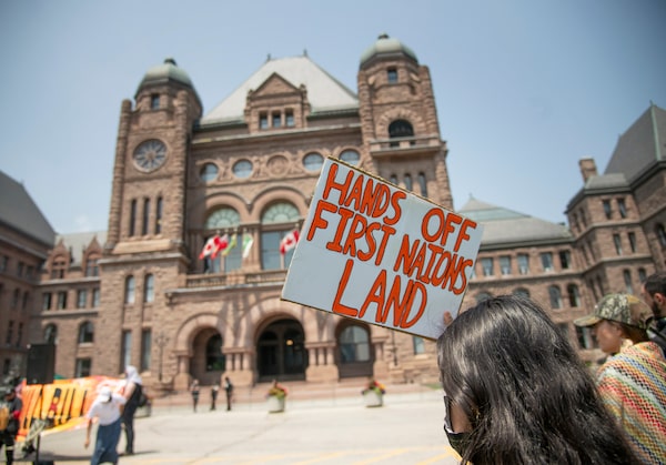 Jason Shron distributes model trains in Canada which are manufactured in China. He is seen sitting in his full-size replica of a Via rail car, in his Toronto home on May 13, 2025. JENNIFER ROBERTS/THE GLOBE AND MAIL