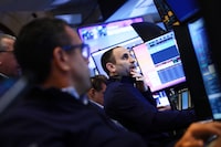NEW YORK, NEW YORK - MARCH 02: Traders work on the floor of the New York Stock Exchange (NYSE) on March 02, 2026 in New York City. Markets were down sharply across the world following the weekend U.S. and Israeli attacks on Iran, with oil prices rising and the Dow falling over 500 points after the opening bell. (Photo by Spencer Platt/Getty Images)