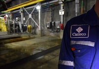 <p>Cameco Corp. reported a first-quarter profit as its revenue rose compared with a year ago, citing strong production of uranium and fuel services. A patch is seen on an employee during a Cameco media tour of the uranium mine in Cigar Lake, Wednesday, September 23, 2015. THE CANADIAN PRESS/Liam Richards</p>