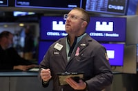 Traders work on the floor at the New York Stock Exchange (NYSE) in New York City, U.S., February 20, 2026.  REUTERS/Brendan McDermid