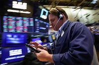 Traders work on the floor at the New York Stock Exchange (NYSE) in New York City, U.S., April 20.
